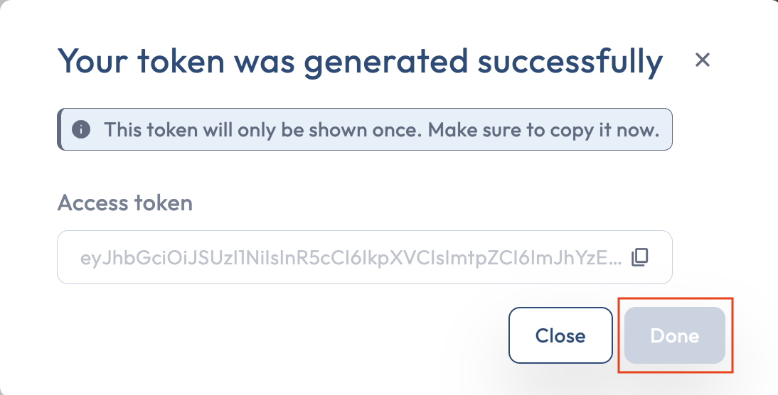 The token one-time reveal modal with the token value, copy button, and a disabled Done button